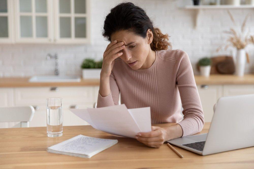 Thinking Homeowner at her desk